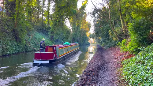 Narrowboat owner navigating the canals on his boat
