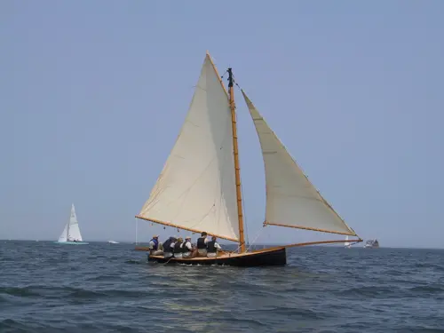 A rigged gaff sail on a sailboat in the sea